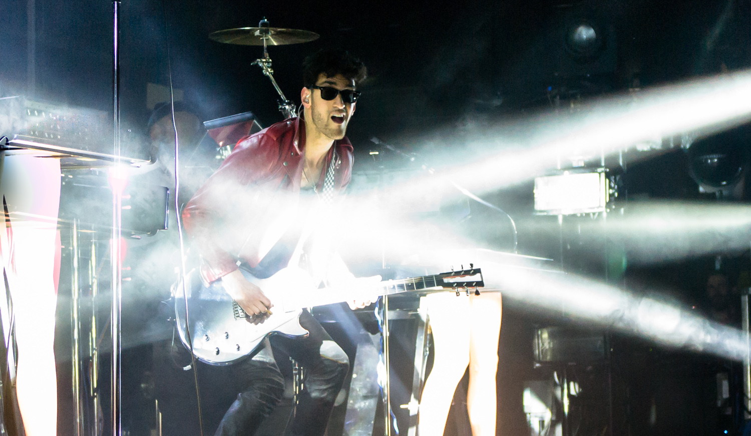 Chromeo performing in beams of white stage light during a Toronto concert.