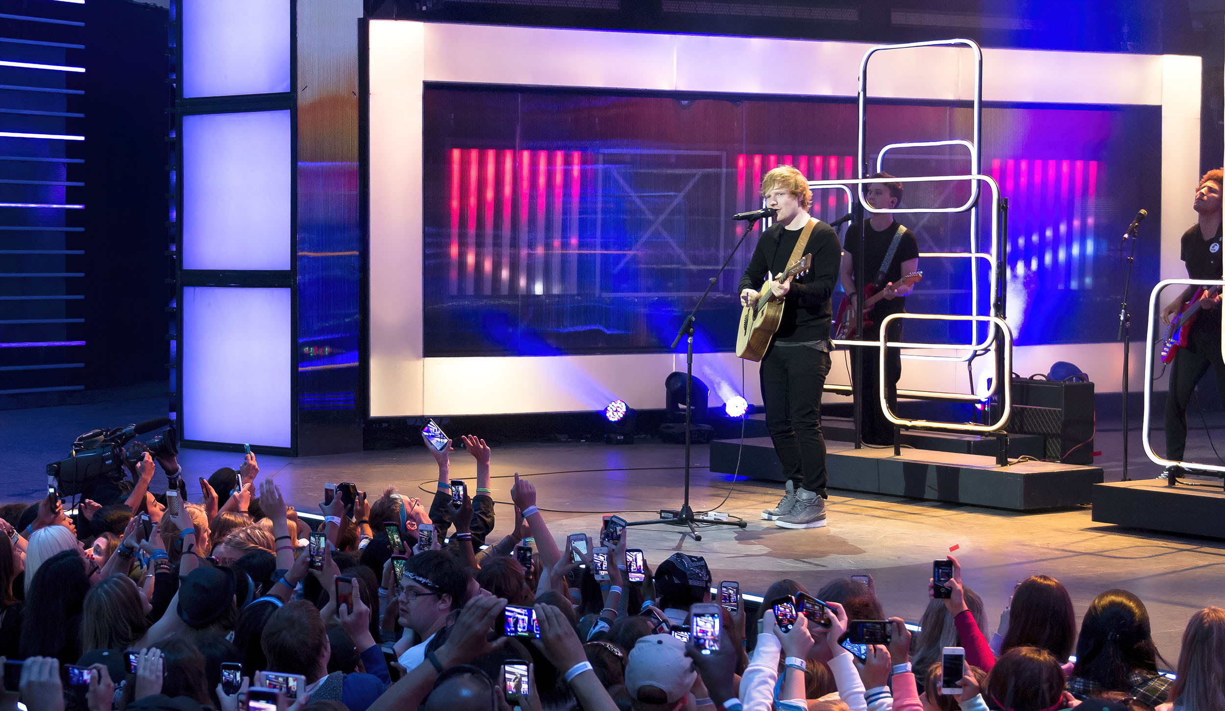 Wide view of Ed Sheeran performing for a large MMVA crowd in Toronto.