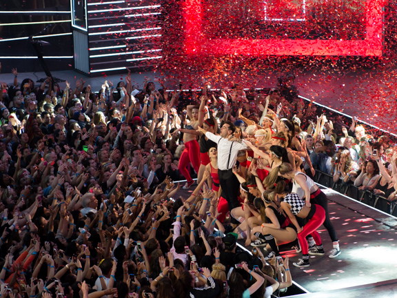Wide view of a live MMVA performance surrounded by a cheering Toronto audience.